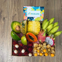 Thumbnail for Tropical Fruit Box assortment featuring mango, pineapple, avocado, dragon fruit, bananas, and longans with a gift card