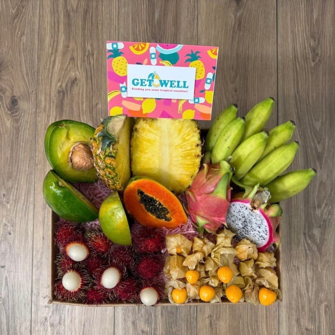 Tropical Fruit Box assortment featuring mango, pineapple, dragon fruit, avocado, bananas, and longans with a gift card.