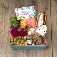 Thumbnail for Tropical Fruit Box with dragon fruit, soursop, cherimoya, pineapple, tamarind, physalis, and honey.
