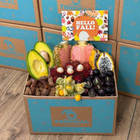 Thumbnail for Tropical Fruit Box Tropical Fall Fruit Feast Box featuring pink pineapple, avocado, dragon fruit, and golden berries.