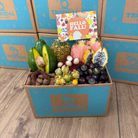 Thumbnail for Tropical Fruit Box Fall Feast gift box filled with pink pineapple, dragon fruit, avocado, longans, and golden berries.
