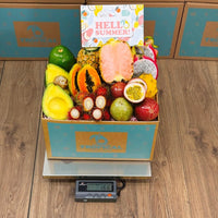 Thumbnail for Tropical Fruit Box filled with fresh pink pineapple, dragon fruit, passion fruit, papaya, and avocado for summer.