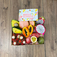 Thumbnail for Tropical Fruit Box TropiSummer gift box featuring pink pineapple, dragon fruit, papaya, avocado, passion fruit, and lychee.